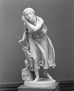 a black and white photograph of the sculpture "Nydia, the Blind Flower Girl of Pompeii" by Randolph Rogers, at the Metropolitan Museum of Art