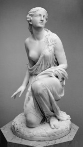 a black and white photograph of the sculpture "Ruth Gleaning" by Randolph Rogers, at the Metropolitan Museum of Art